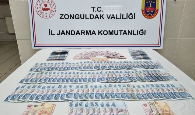 Zonguldak'ta kendisini jandarma personeli olarak tanıtan dolandırıcı, &...
