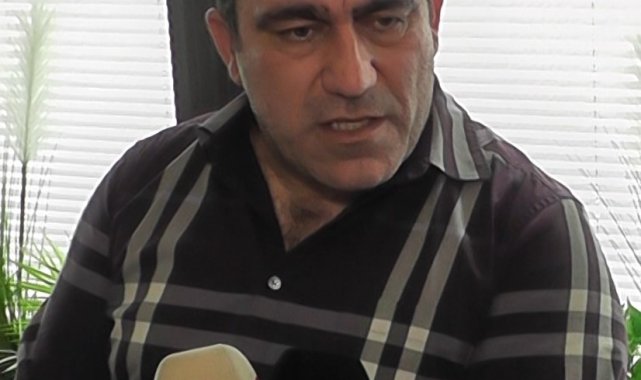 Kayserispor Yönetim Kurulu Başkanvekili Nurettin Açıkalın, sarı kırmızılı t...