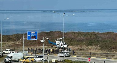 Trabzon'da sahil yolu kenarına acil iniş yapan helikopter korkuttu