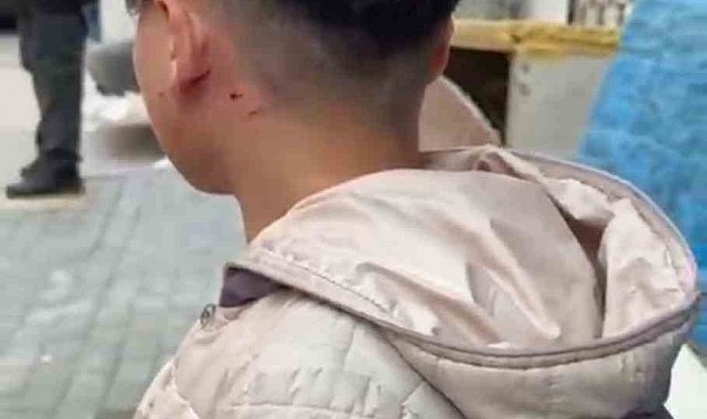 Camı tıklattığı için çocuğu darp etti