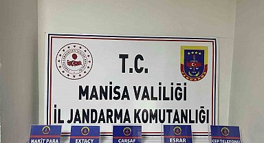 Manisa'da şüpheliden esrar ve uyuşturucu hap çıktı