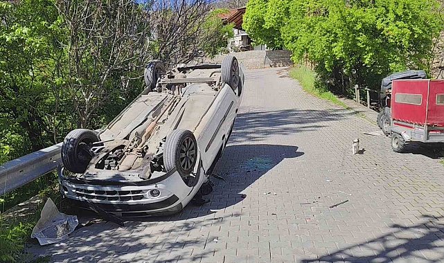 Ters dönen otomobilden yara almadan kurtuldu