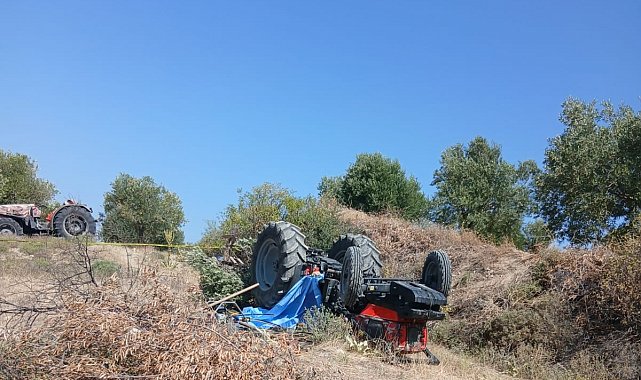 Devrilen traktörün altında can verdi