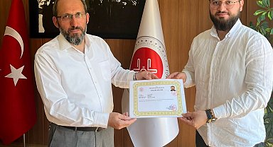 Hisarcık Kaymakamı Bahar'dan İlçe Müftüsü Akyol ve personele başarı belgesi