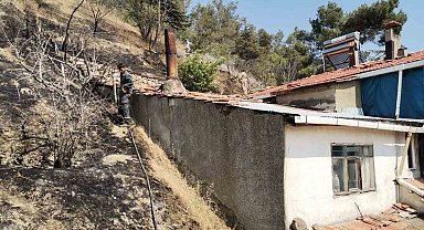 Otluk alanda çıkan yangın eve sıçramadan söndürüldü