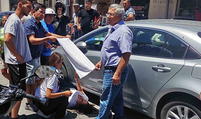 Vatandaşlar yaralı kadın sürücüyü güneşten havluyla korudu