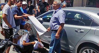 Vatandaşlar yaralı kadın sürücüyü güneşten havluyla korudu