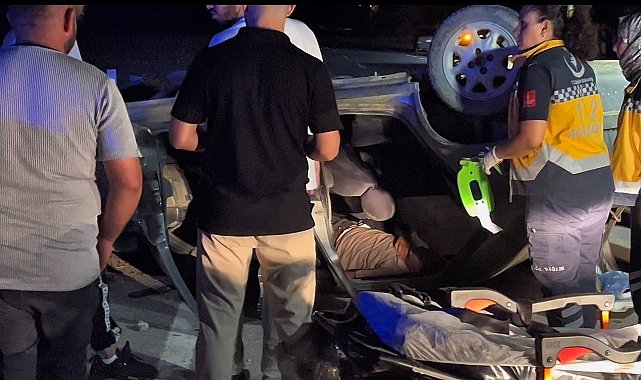 Takla atan otomobilde sıkışan sürücüyü itfaiye ekipleri kurtardı