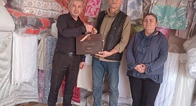 Tavşanlı'da 40 yılı aşkın esnafa ziyaret ve hediye