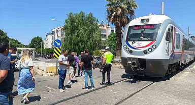 Trenin altında kalan yaya ağır yaralandı