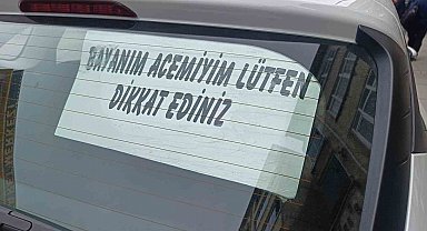 Acemi sürücünün arka cam yazısı dikkat çekti