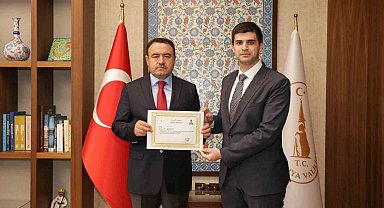 Vali Işın'dan Kaymakam Teltik'e başarı belgesi