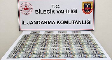 Bilecik'te otomobilde 202 adet sahte dolar ele geçirildi