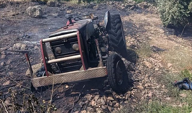Erzin'de otluk alanda çıkan yangında alevler traktöre sıçradı