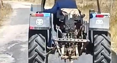 Köpeği traktöre bağlayarak sürükledi